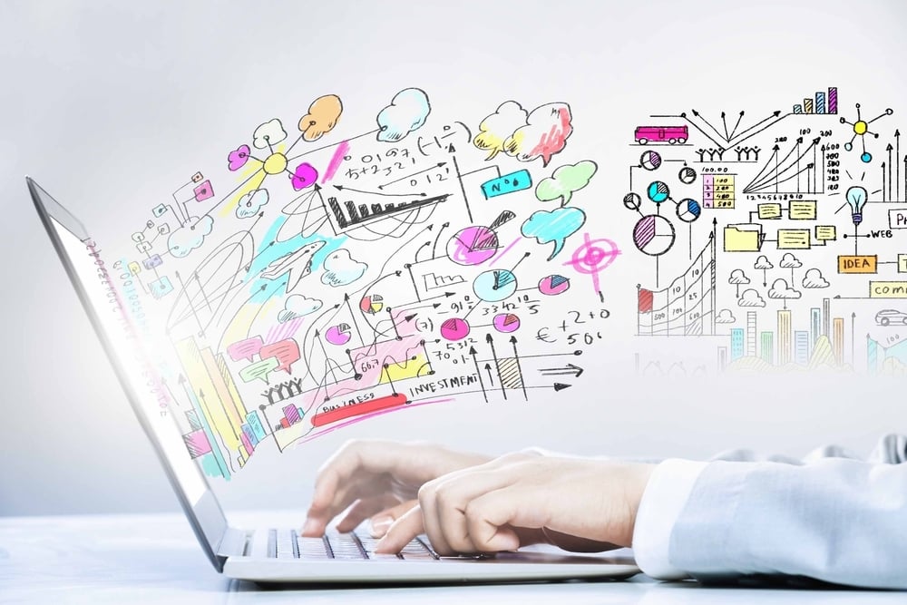 Close up image of laptop and human hands typing on keyboard